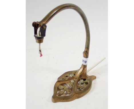 An Art Nouveau brass lamp with mistletoe to base 