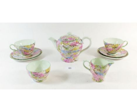 A Shelley Chintz 'Rock Garden' bachelor tea service comprising: teapot, two cups and saucers, milk and sugar 