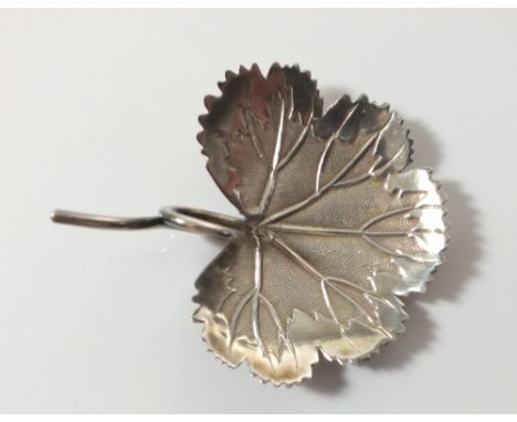 A silver leaf form caddy spoon with tendril handle, Birmingham  1807 by Matthew Linwood 