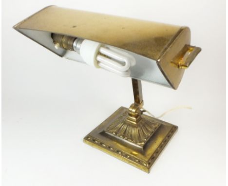 An early 20th century square base desk lamp with brass shade 