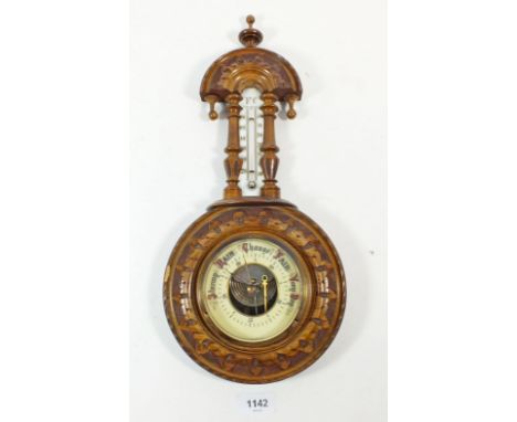 An early 20th century mahogany carved barometer 