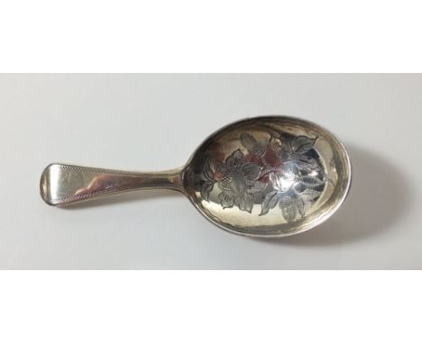 A silver Old English caddy spoon with engraved flower to bowl, London 1815, by James Beebe 