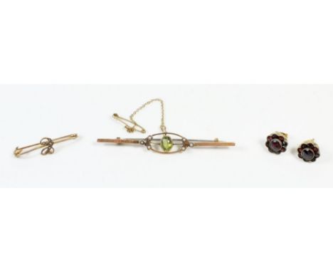 An Edwardian 9ct gold peridot and seed pearl brooch 2.5g, a yellow metal brooch and a pair of garnet earrings 