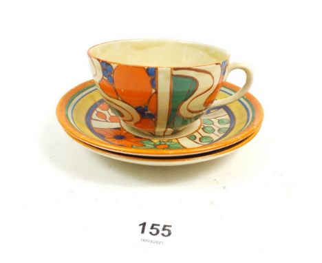 A Clarrice Cliff tea cup and two saucers with marks for Lawleys 
