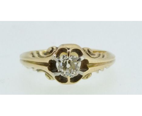 An 18ct gold diamond solitaire ring, claw set on scrollwork shoulders, approx 1/2 ct, Size M/N, unmarked 