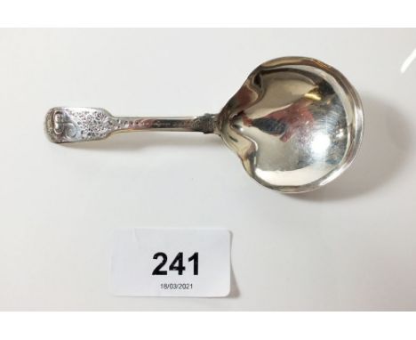 A silver fiddle pattern caddy spoon with engraved decoration, London 1812, by Thomas Richards 