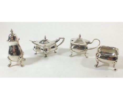 A silver three piece cruet set Sheffield 1973 by CB&amp;S, 152g and a silver mustard with glass liner and matched spoon, 48g 