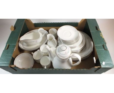 A Royal Doulton 'Carnation' dinner and coffee service comprising: six dinner plates, six breakfast plates, four side plates, 