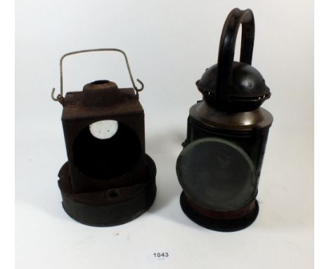A GWR guard's triple aspect lamp together with another signal lamp 