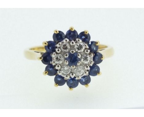 An 18ct gold sapphire and diamond cluster ring, 5g, size M/N, 12mm diameter 