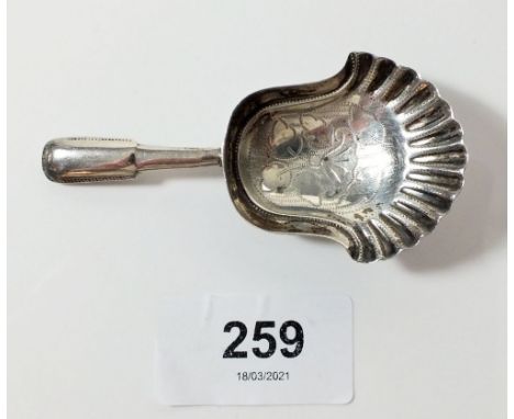 A silver caddy spoon with engraved shell bowl, London 1907, maker Garrad &amp; Co 