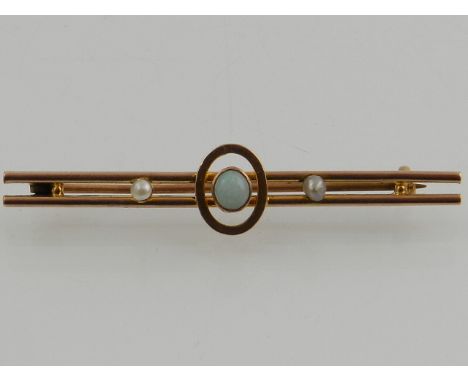 A Victorian 9 carat yellow gold, opal, and split seed pearl bar brooch. 