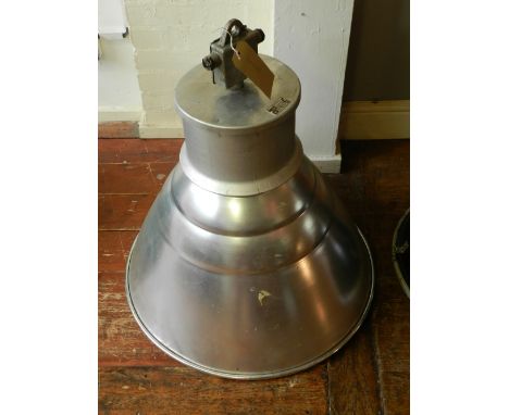 A silvered industrial hanging light.