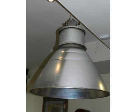 A silvered industrial hanging light.