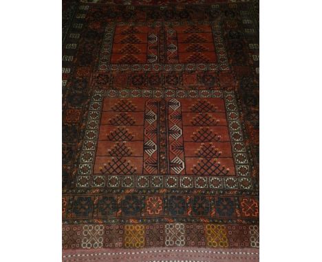 An early 20th century Turkoman carpet, decorated with geometric pattern within many borders. L.210cm W.163cm