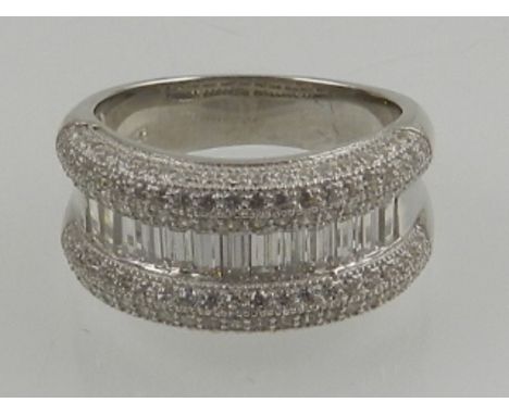 A silver and cubic zirconia set half eternity cocktail ring. 