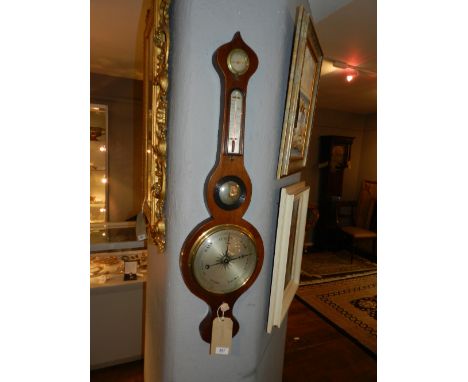 An oak wheel barometer. H.94cm