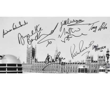 Doctor Who - a multi-signed autographed 12x14" black and white photograph from the series, signed by x11 stars who appeared i