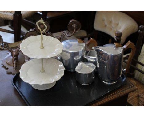 A Picquotware coffee pot, tea pot, sugar bowl and milk jug with a two tier ceramic cake stand