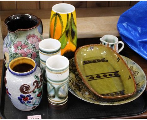 A collection of studio pottery pieces and a Poole vase
