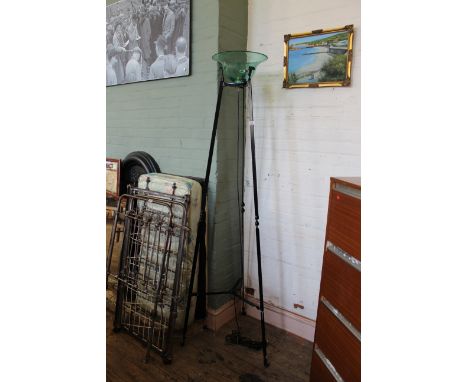 A large tripod standard lamp with glass bowl shade