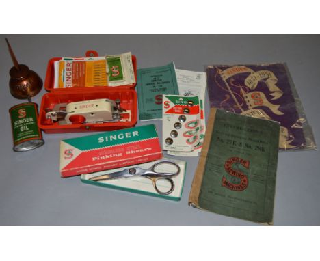 A collection of Singer Sewing related collectables and ephemera