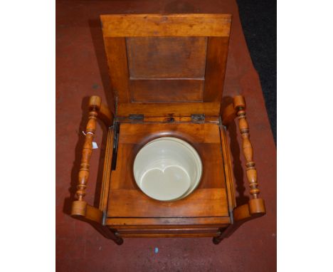 A pair of commodes with original ceramic chamber pots. Approx 57cm tall.