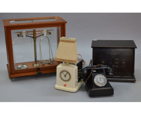 A good interesting mixed lot of collectables including cased set of scales, bakelite telephone, an electro-pneumatic massage 