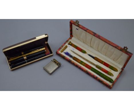 A small mixed lot including various fountain pens, a lighter etc