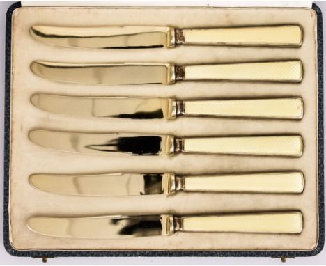 Three Cased Sets of Silver Gilt Flatware, including - a set of six Continental silver and yellow enamel butter knives, with i