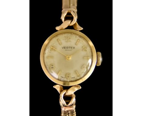 A Lady's Manual Wind Wristwatch, by Vertex, 9ct gold case,19mm diameter, silver dial with gold Arabic and baton numerals, on 