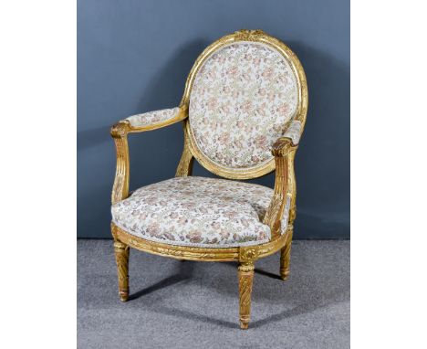 A 19th Century Gilt Wood Framed French Fauteuil, the frame carved with leaf and scroll ornament, the back, seat and arms upho