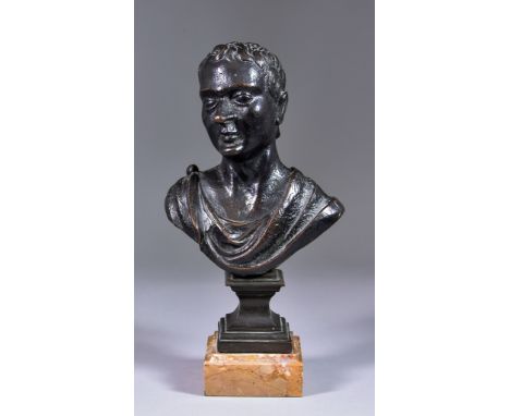 An 18th Century Italian School - Brown patinated bronze - Bust of a man, wearing paludamentum and on later square socle and m