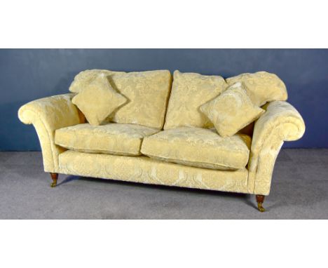 A Modern Two-Seat Settee, upholstered in cream cloth, on turned legs and castors, 82ins wideDepth of the sofa is 36ins. Heigh