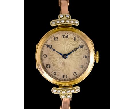 A Lady's Manual Wind Cocktail Watch,&nbsp;9ct gold case, 26mm diameter, silver radial dial, black Arabic numerals, on expandi