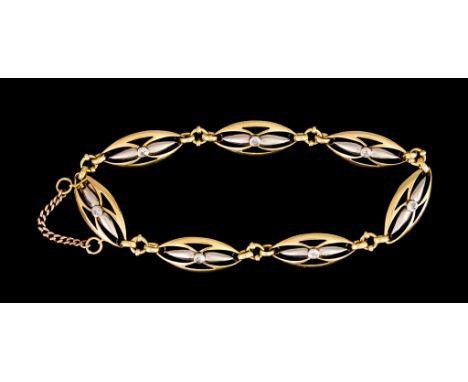 A Two Coloured Gold and Diamond Set Bracelet, set with seven small brilliant cut white diamonds, approximately 200mm overall,