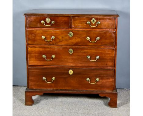 A George III Mahogany Chest, with moulded edge to top, fitted two short and three long graduated drawers, on bracket feet, 35