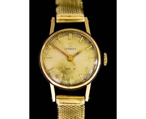 A Lady's Manual Wind Wristwatch, by Tissot, 9ct gold case, 20mm diameter,&nbsp;silver dial with gold baton numerals, on confo