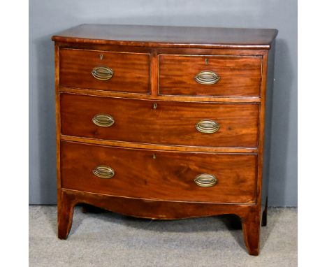 A George III Mahogany Bow Front Chest with rounded edge to top, fitted two short and two long graduated drawers, on shaped ap