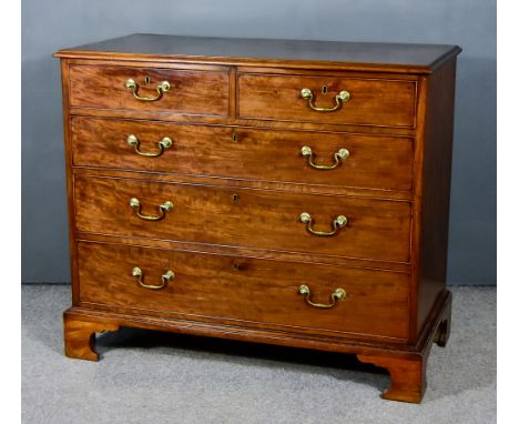 A George III Mahogany Chest, with moulded edge to top,&nbsp;fitted two short and three long graduated drawers, on bracket fee