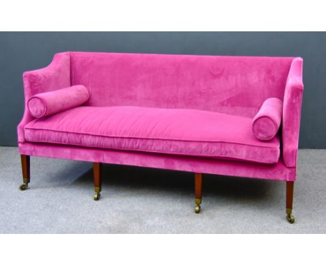 A 19th Century Mahogany Square Back Settee, upholstered in pink dralon, on square tapered legs with brass toes and castors, 7