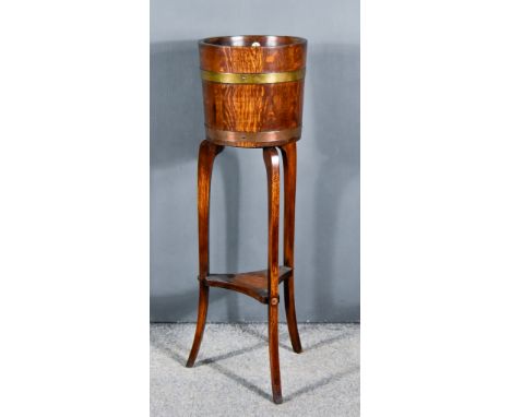 An Early 20th Century Oak and Copper Bound Cylindrical Jardiniere on Stand,&nbsp;retailed by R. Alister &amp; Co Ltd,&nbsp;th