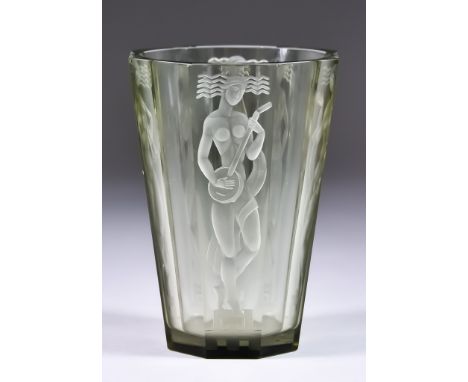 An Orrefors Glass Vase by Vicke Lindstrand, stylised with Art Deco figures, signed and dated 30', 5.5ins highThere is no obvi