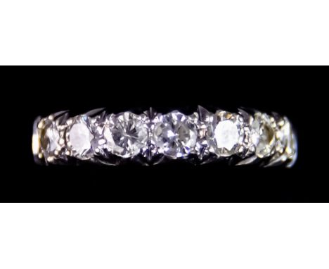 An 18ct White Gold Seven Stone Diamond Ring, set with seven brilliant cut white diamonds, approximately .75ct total, size M, 