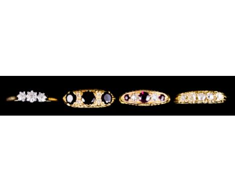Four 18ct Gold Gem Set Rings, comprising - a five stone diamond ring, size K+, a three stone diamond ring, size N+, a red and