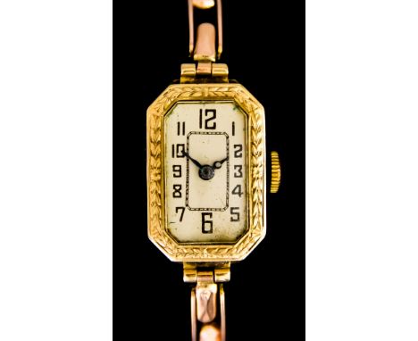 A Lady's Manual Wind Wristwatch, 9ct gold case, 21mm x 14mm, silver dial with black Arabic baton numerals, expanding 9ct gold