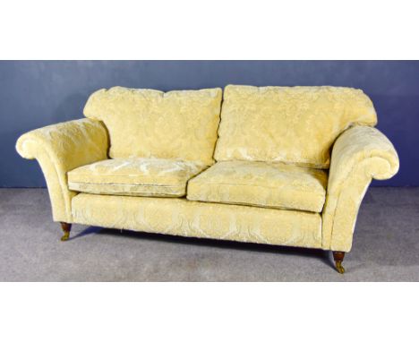 A Modern Two-Seat Settee,&nbsp;upholstered in cream cloth, on turned legs and castors,&nbsp;82ins wideThis item appears to be