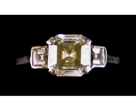 A Platinum Solitaire Diamond Ring, Modern, set with a centre rectangular stepcut natural diamond of 2ct flanked by two natura
