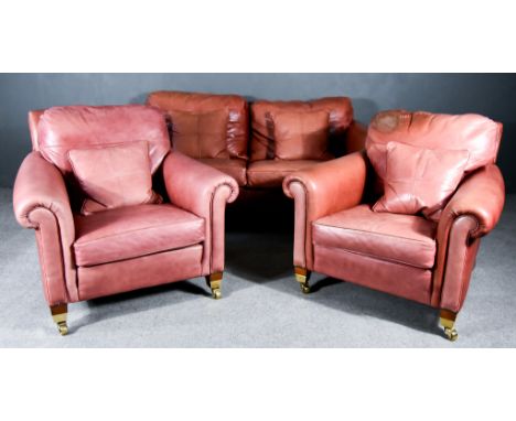 A Modern Duresta Three Piece Lounge Suite, upholstered in red leather, on square legs and castors, comprising -&nbsp;two seat