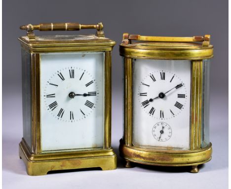 A French Oval Carriage Clock and One Other Carriage Clock,&nbsp;the oval clock with white enamel dial with Roman numerals and